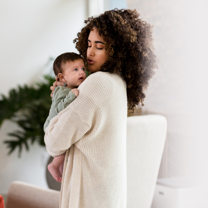 woman and baby standing
